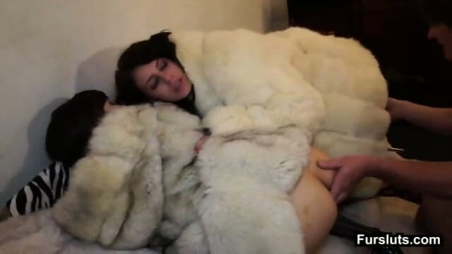 Two Brunettes Fucked In White Fur Coat